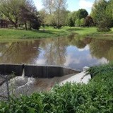 Trendwood Park (77th and A) - Outlet structure slowly releasing flood waters.
