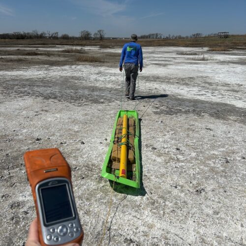 TFG staff using a UNL Dualem Electrical Resistivity scientific device to monitor soil salinity as part of long term site monitoring.